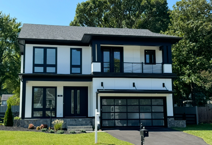 exterior of white home with shingled roof